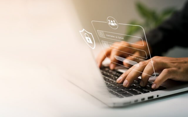 User typing with data protection on a laptop
